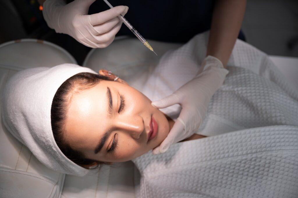 relaxed-woman-receiving-cosmetic-treatment-in-clin-2026-01-09-07-21-47-utc Large