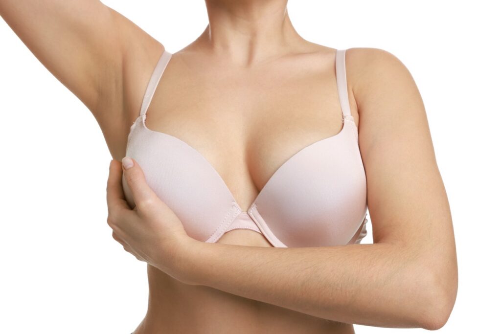 woman-poses-in-pink-bra-on-white-background-2026-03-26-23-55-44-utc Large